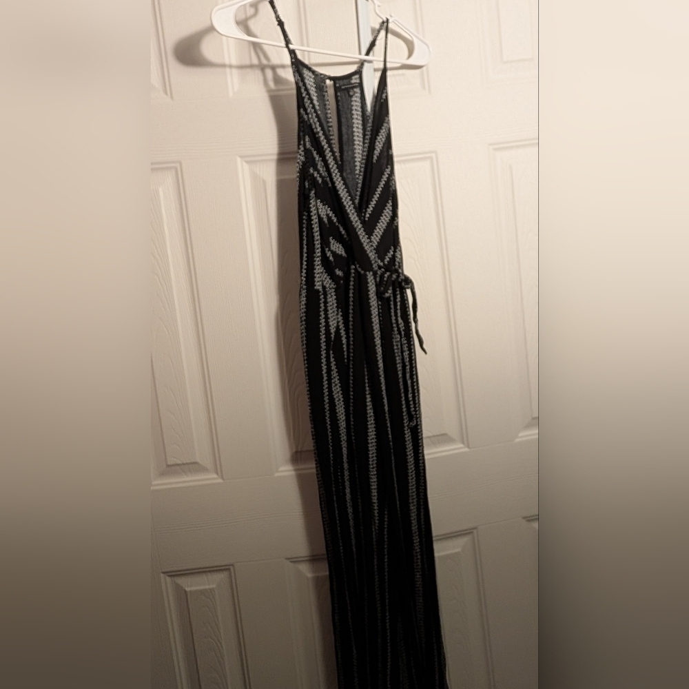 Staccato Black Sleeveless Resort Jumpsuit Plunge Neckline